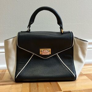 Black and white Kate Spade letter-style leather handbag